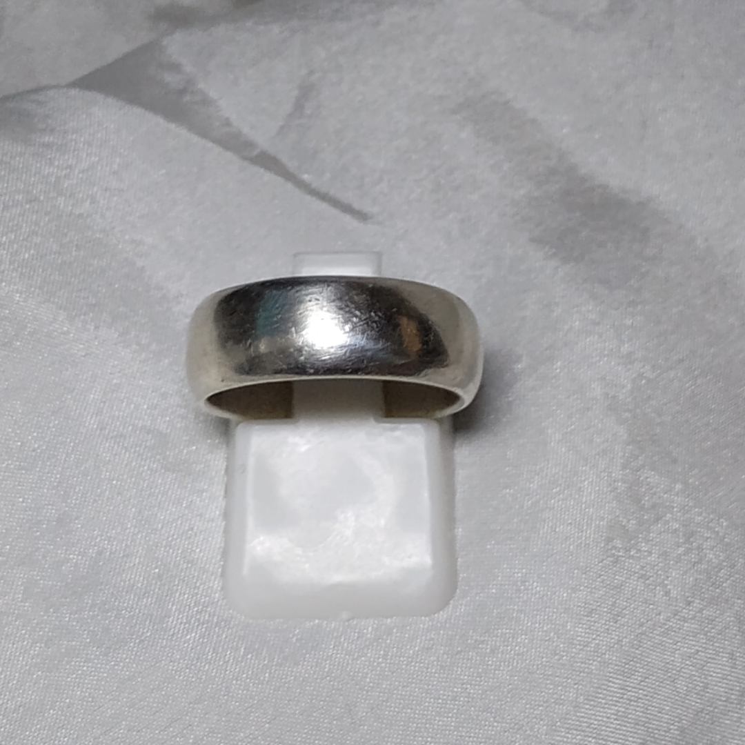 Wide band sterling silver ring with a smooth, minimalist finish