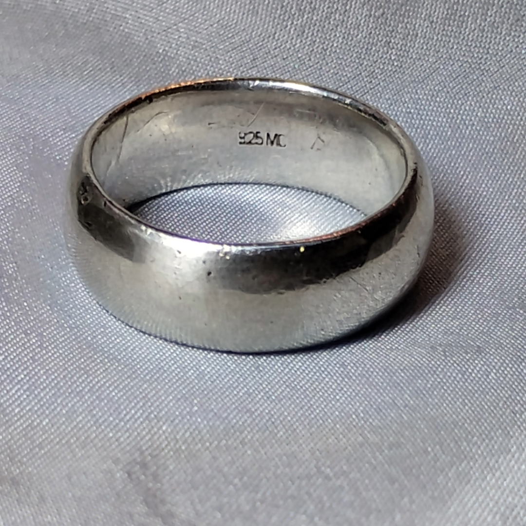 Close up shot of a vintage wide band silver ring, size 6, from Violet Dreamer.