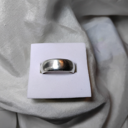 Close  up shot of a vintage wide band silver ring, size 6, from Violet Dreamer.